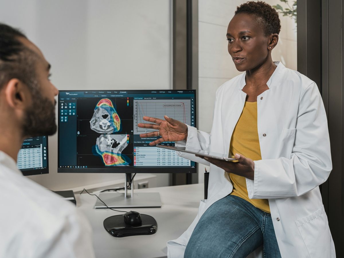 Two clinicians reviewing patient information together at a workstation