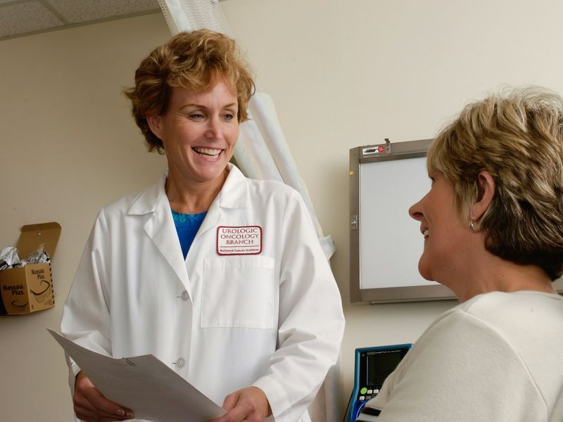 A care provider meeting with an older adult patient
